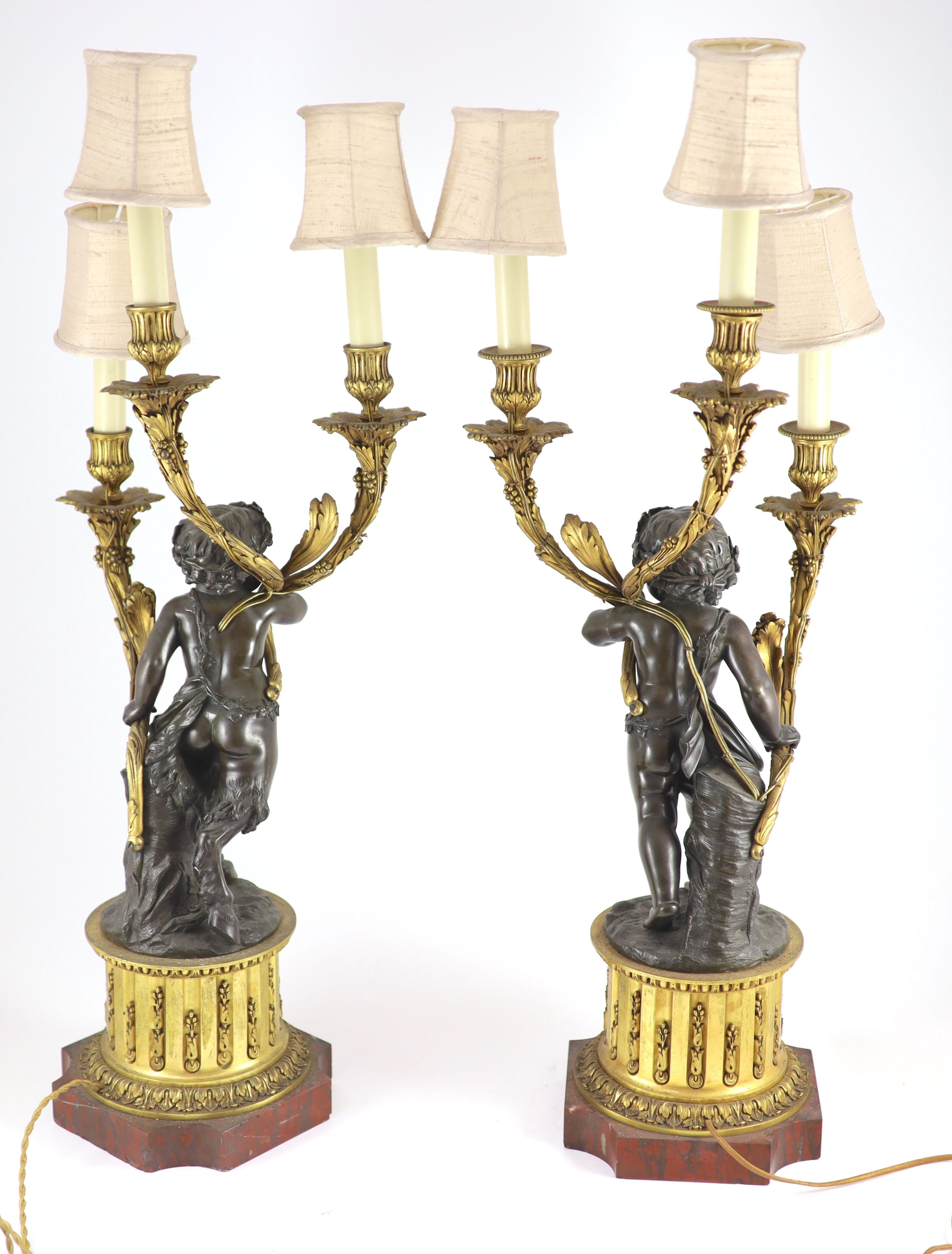 A pair of 19th century French bronze and ormolu three light candelabra, after Clodion height 66cm